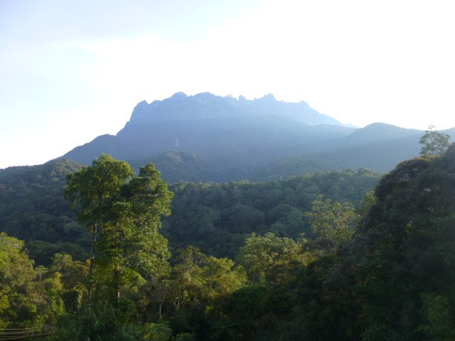 Mount Kinabalu viewed from the rainforest below in Sabah, Malaysia.